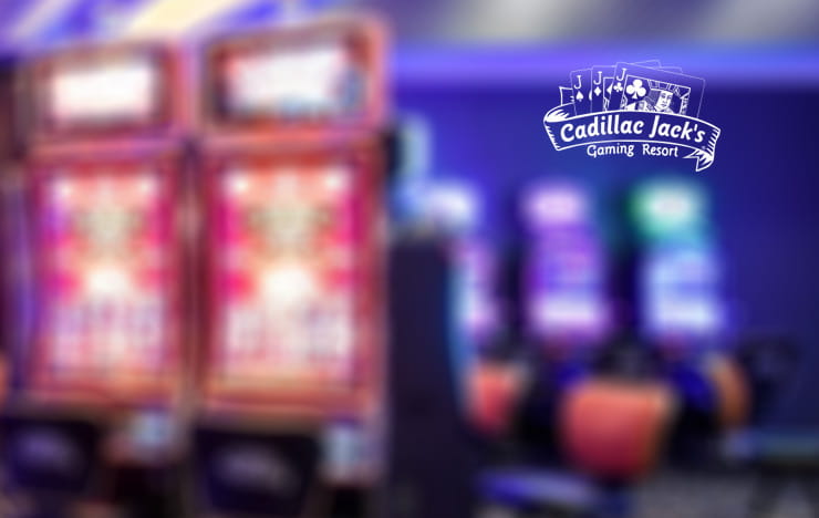 The logo of Cadillac Jacks next to some slot machines.