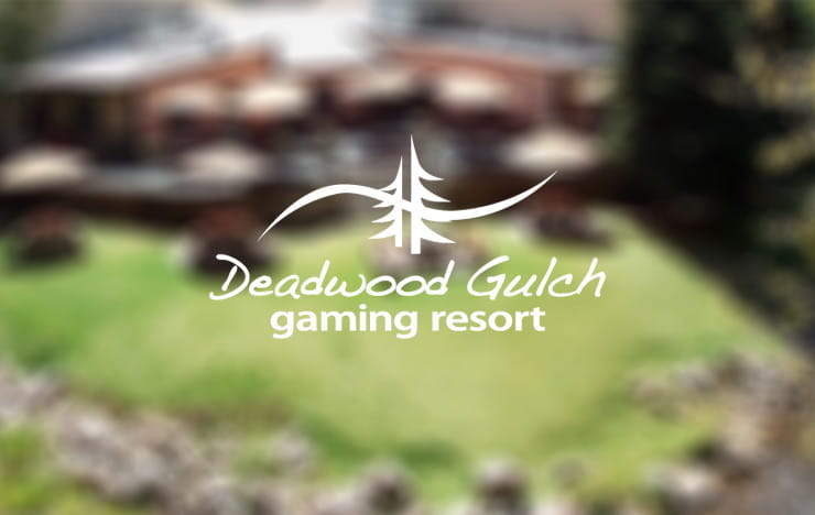 The Deadwood Gulch Gaming & Resort Logo over the trees of a forest.