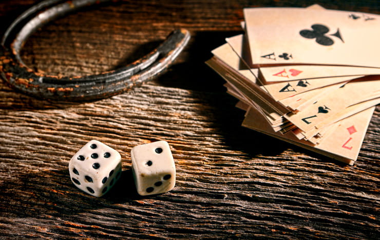 Old and whithered playing cards and dice.