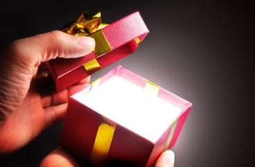 A present box with a gold glow.