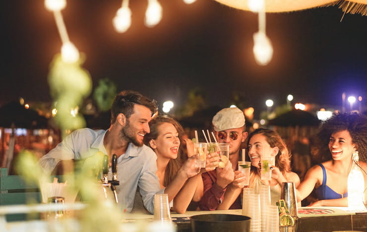 A group of friends enjoying drinks at a bar.