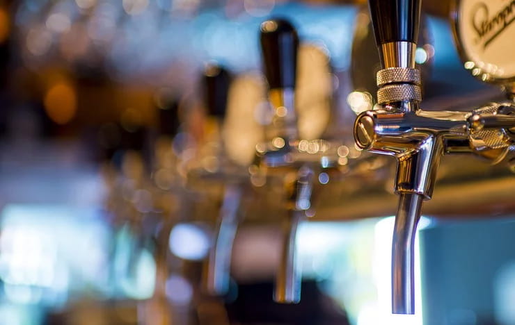 A row of beer taps.