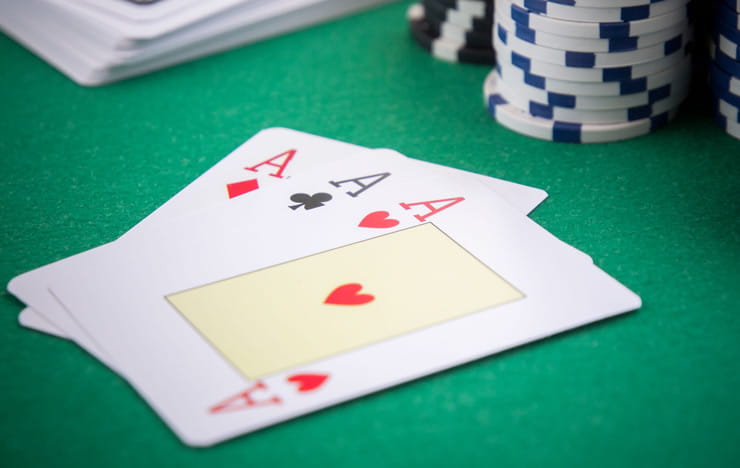 A poker hand showing pocket aces