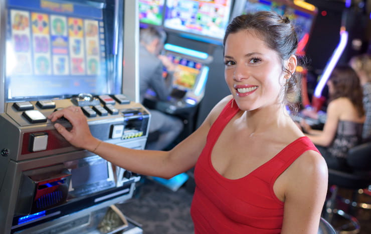 A woman playing slot machines.